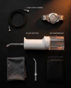 Flat-lay travel kit with the water flosser, nozzle, cable and pouch