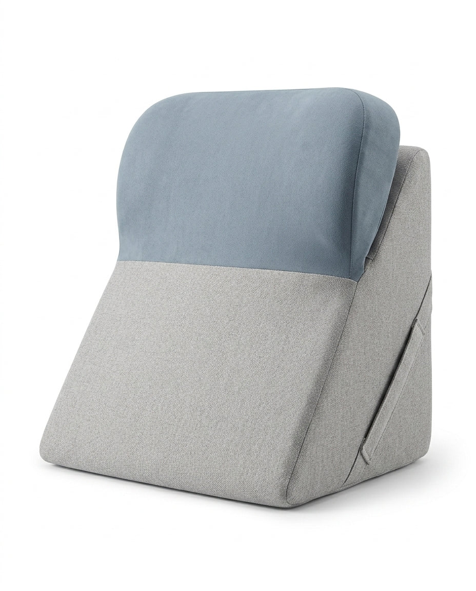 Light gray wedge lounger with dusty blue contoured headrest bolster on white