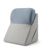 Light gray wedge lounger with dusty blue contoured headrest bolster on white