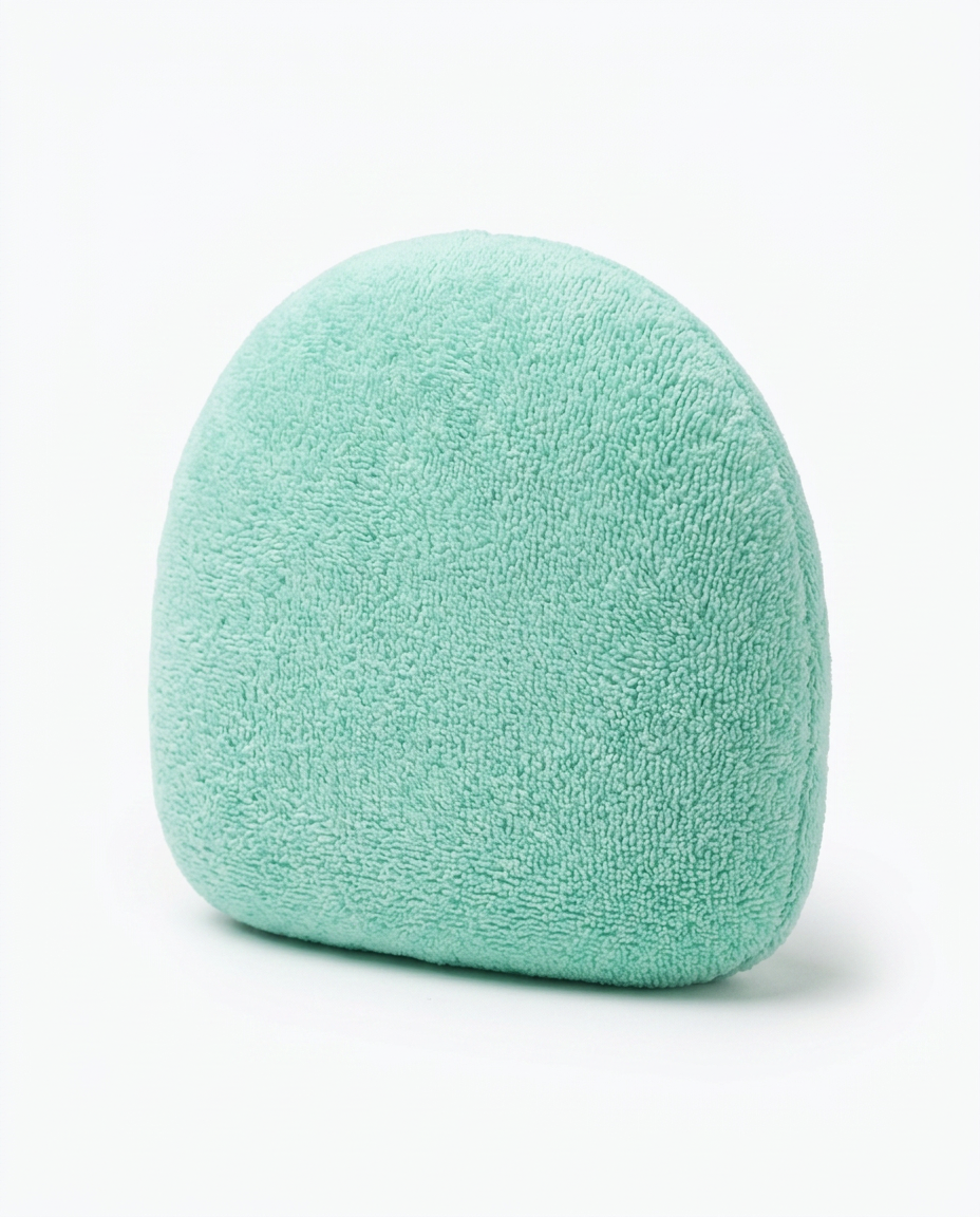 Mint green no-finger palm cradle hand cushion on a white background