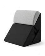 Black wedge lounger with light gray contoured headrest bolster on white