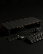 Riser USB hub connected to keyboard, webcam and phone on a desk