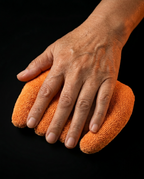 Hand resting in the cushion channels demonstrating anti-contracture positioning