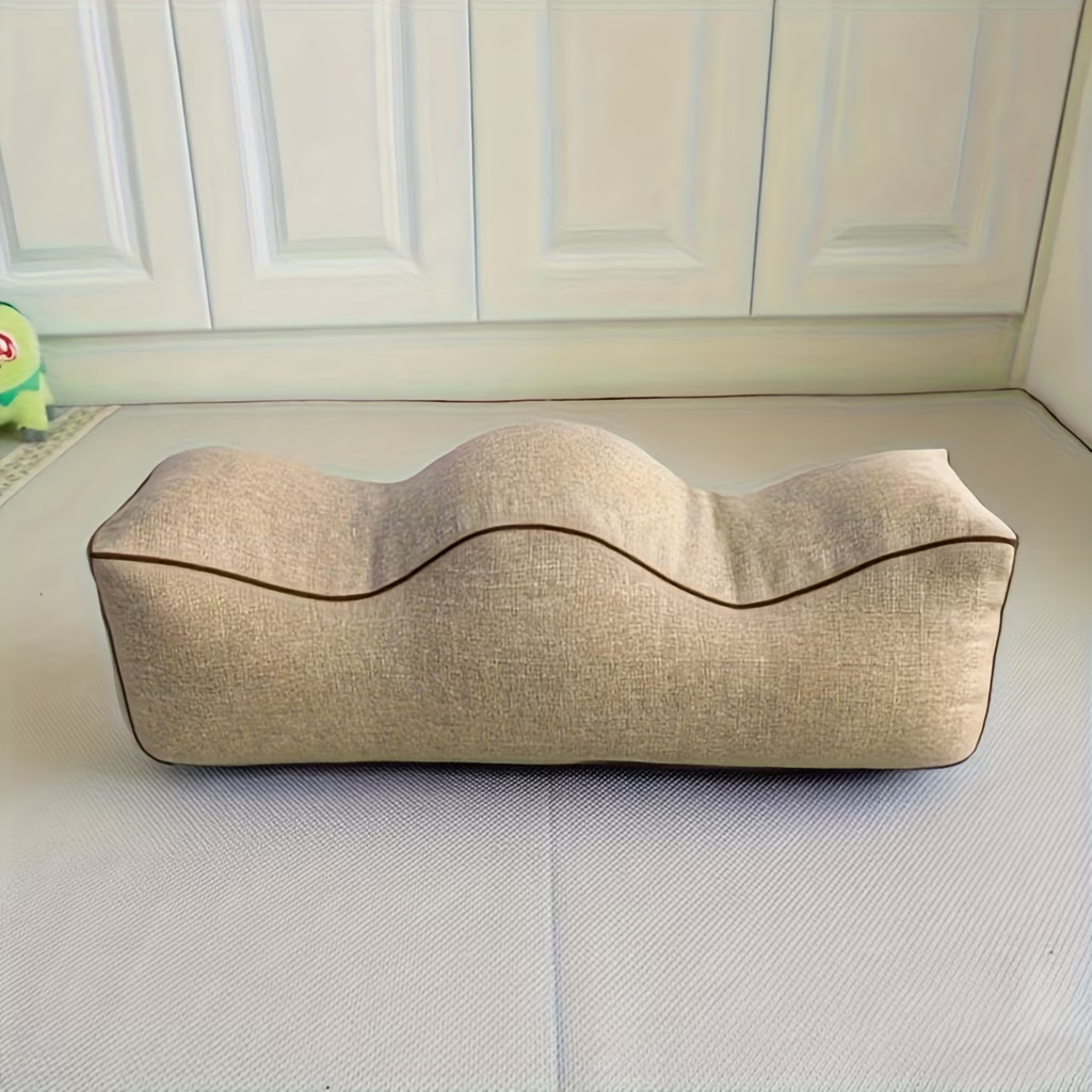 Beige linen leg support pillow with twin contoured channels, front view