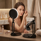 Woman applying makeup using the LED-lit magnifying vanity mirror at her vanity