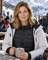 Beheizbare Unisex-Weste PyreFit Aurina im Winteralltag: Beim Skifahren